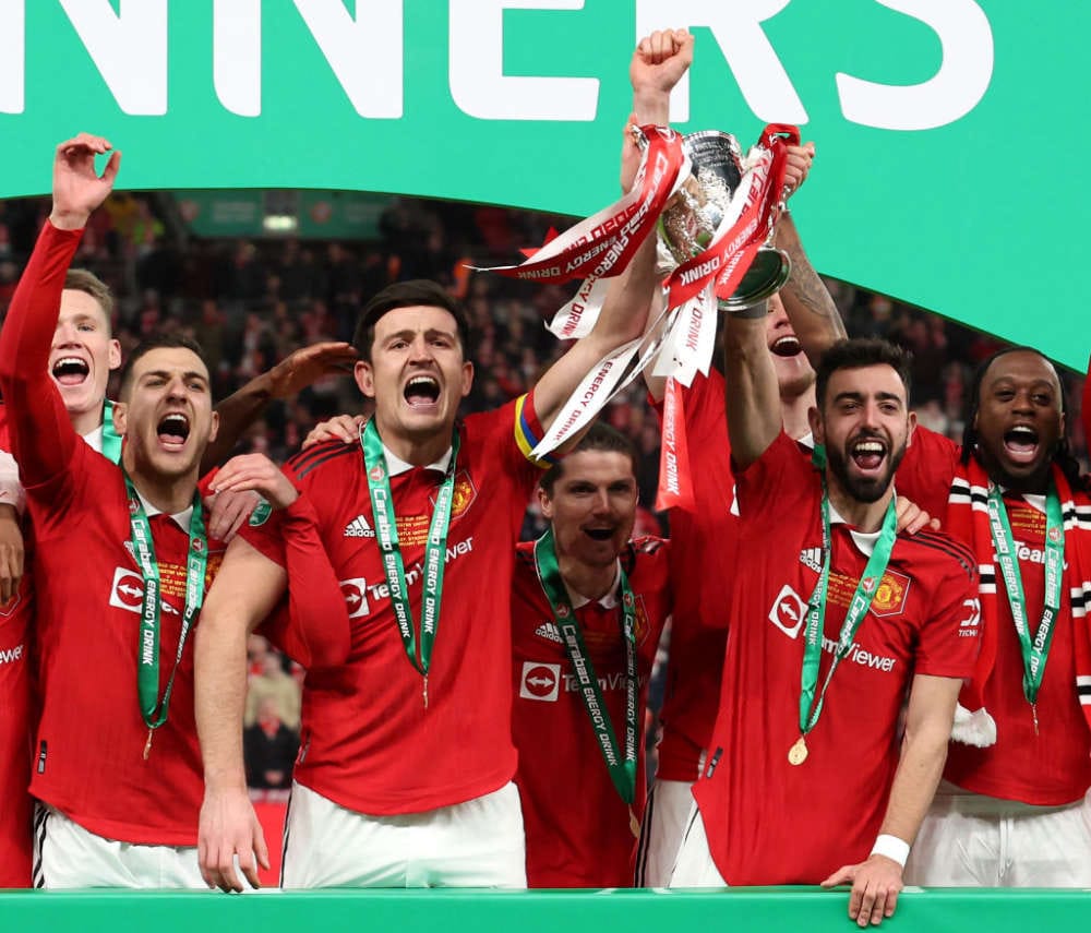 Man United's Bruno lifting the EFL trophy