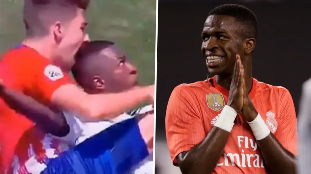 Real Madrid's Vinicius being bit by Athletico Madrid player